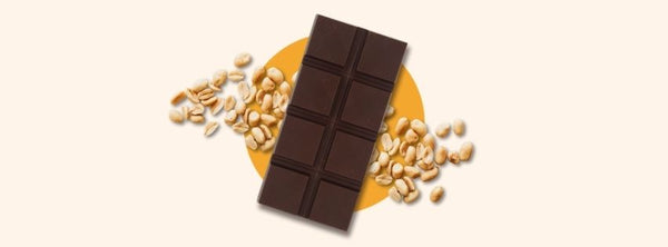 A bar of milk chocolate with peanuts