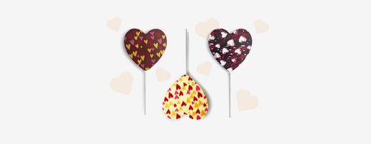 Three heart-shaped Valentine's lollipops