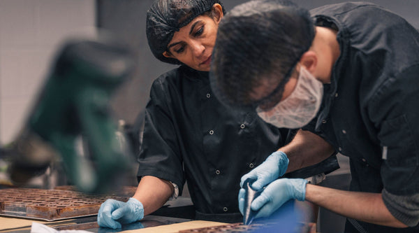 Harry Specters founder, Mona, training an autistic chocolatier as they make luxury chocolates