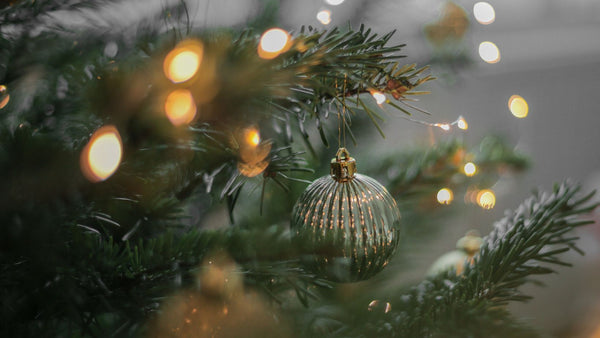 A Christmas tree decorated with baubles and lights