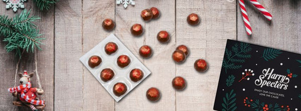 A selection of Christmas mine pie chocolates on a festive background