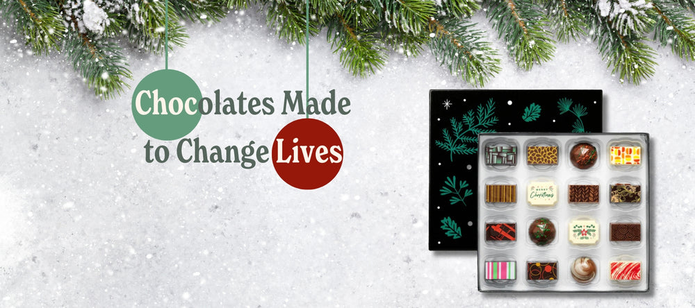 A box of Christmas chocolates with the message 'Chocolate made to change lives'