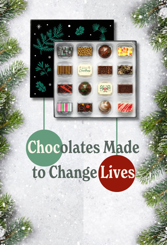 A box of Christmas chocolates with the message 'Chocolate made to change lives'