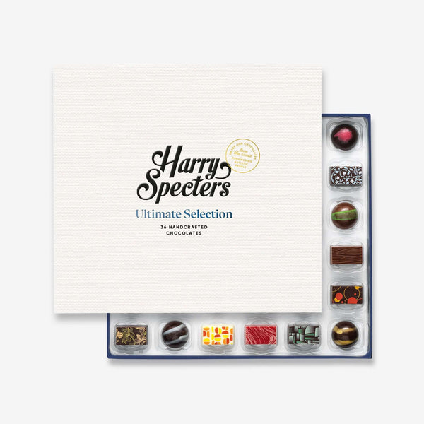 A good luck chocolate box with colourful chocolates peeking out behind a Harry Specterss lid