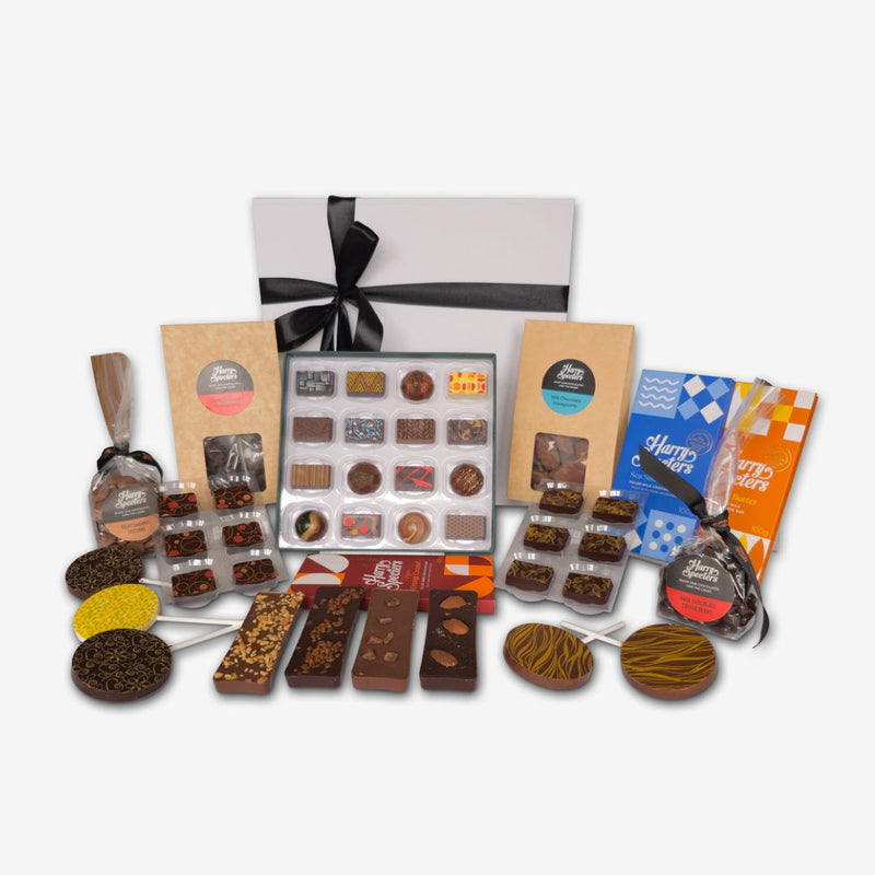 A large chocolate hamper featuring chocolate bars, lollipops, mini treats, and a box of premium chocolates