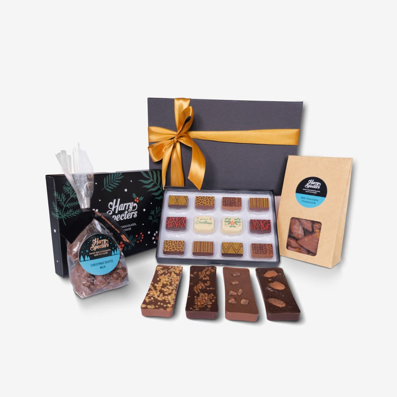 A small chocolate Christmas hamper including chocolate honeycomb, shapes, miniature bars, and a box of premium chocolates