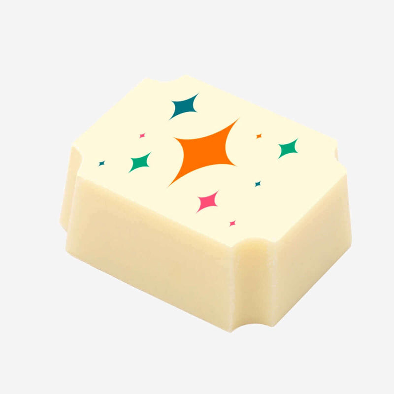 A white chocolate with a colourful star pattern printed on the top
