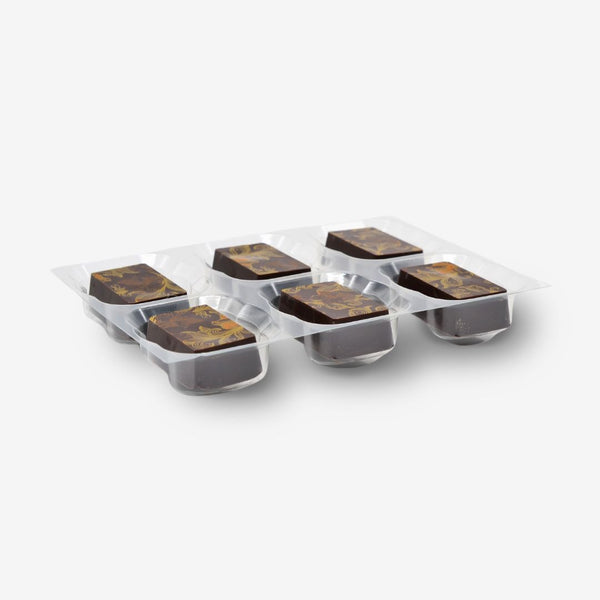 A tray of 6 orange caramel dark chocolates