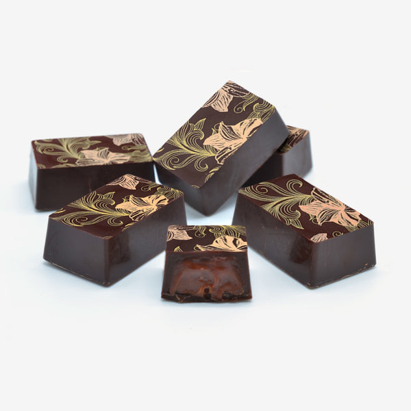 Six luxury dark orange caramel chocolates