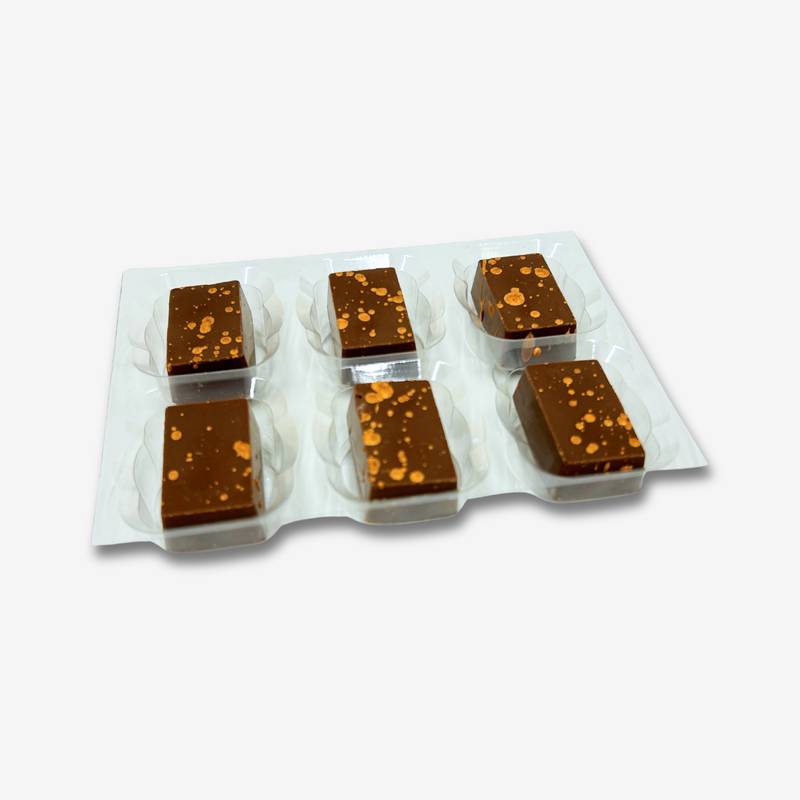 A tray of 6 pineapple caramel milk chocolates