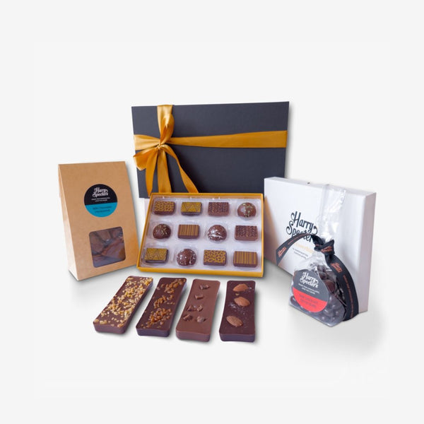 A small chocolate hamper including mini chocolate bars, coffee beans, honeycomb, and a box of luxury chocolates