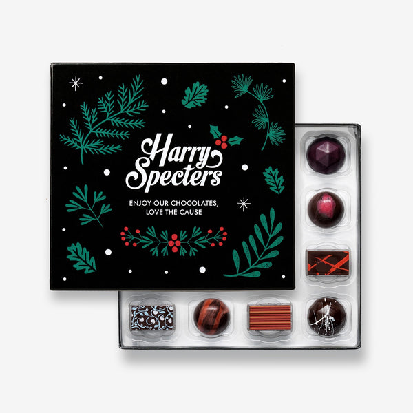 A box of plant-based Christmas chocolates partially closed