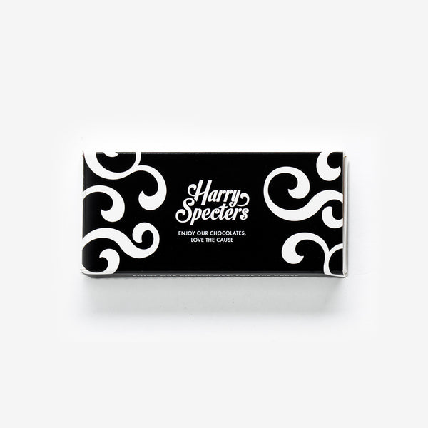  The front of this 2-chocolate box, which contains a white chocolate with a printed Merry Christmas message