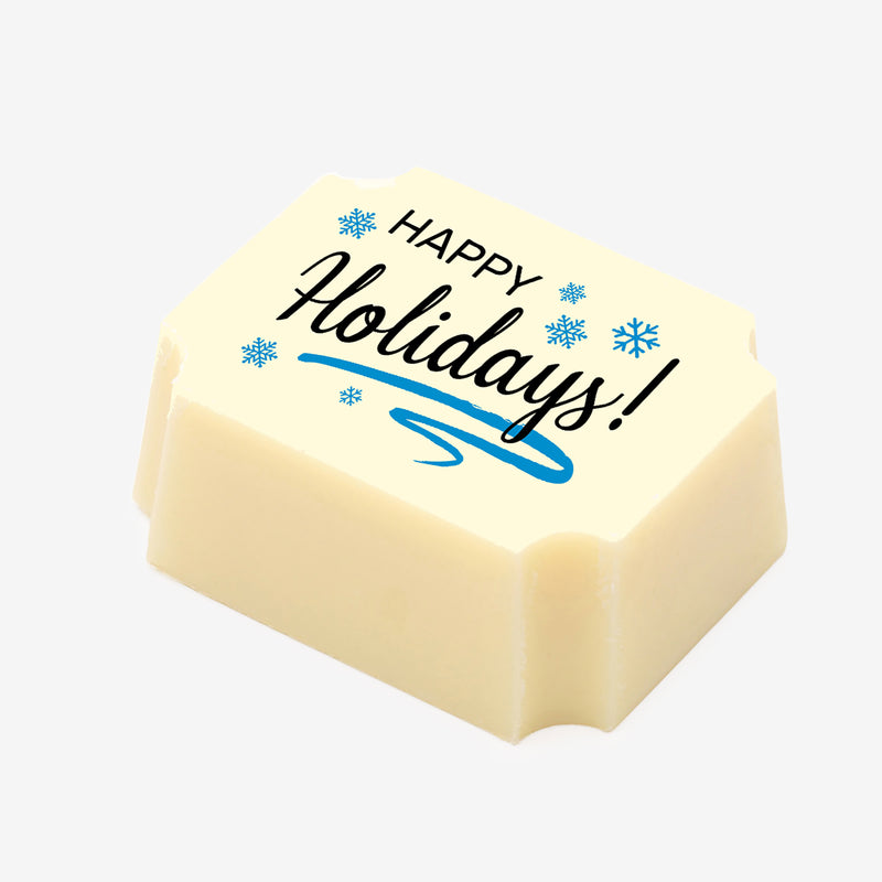 A white chocolate filled with dark chocolate ganache, made by Harry Specters, with a Happy Holidays message printed on the top.